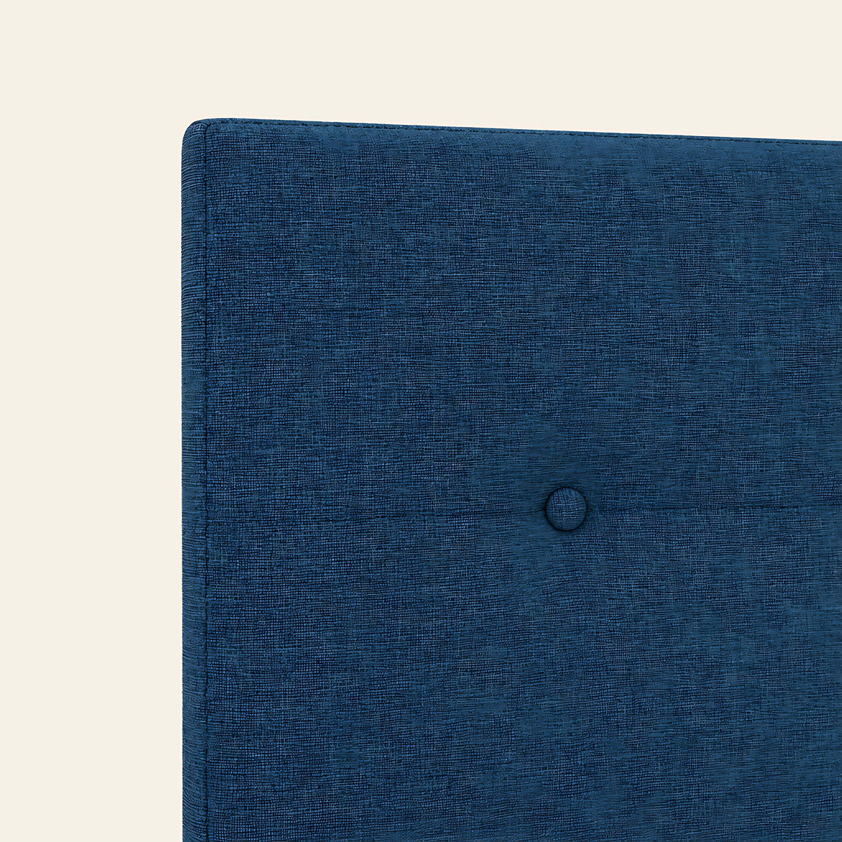 Gros plan du tissu chiné bleu nuit et de son bouton, tête de lit Marais